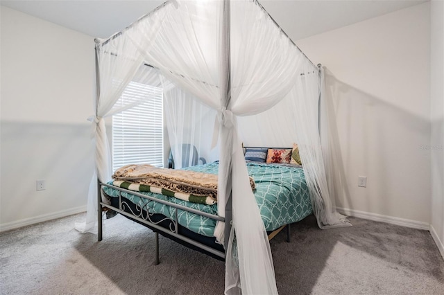 bedroom featuring light colored carpet