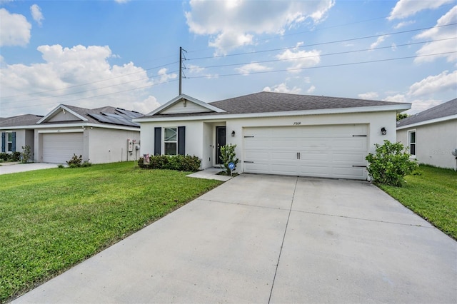 ranch-style house with a front lawn, solar panels, and a garage