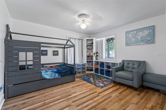 bedroom featuring hardwood / wood-style floors and ceiling fan