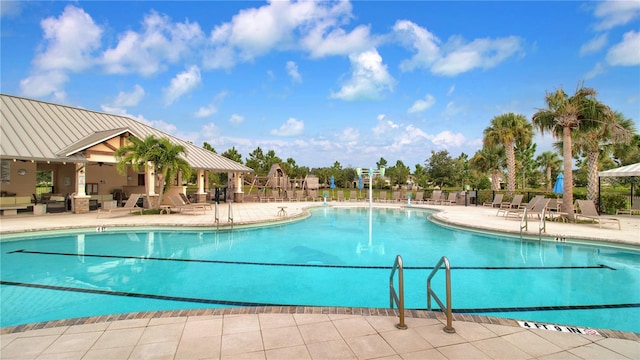 view of swimming pool featuring a patio