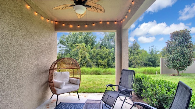 view of patio / terrace featuring ceiling fan