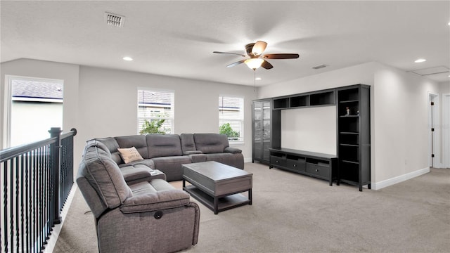 living room featuring a textured ceiling, light colored carpet, ceiling fan, and lofted ceiling