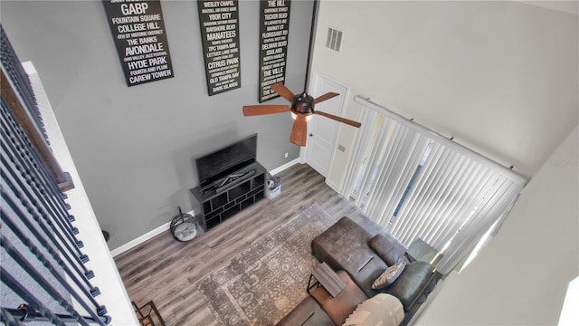 living room with hardwood / wood-style flooring and ceiling fan