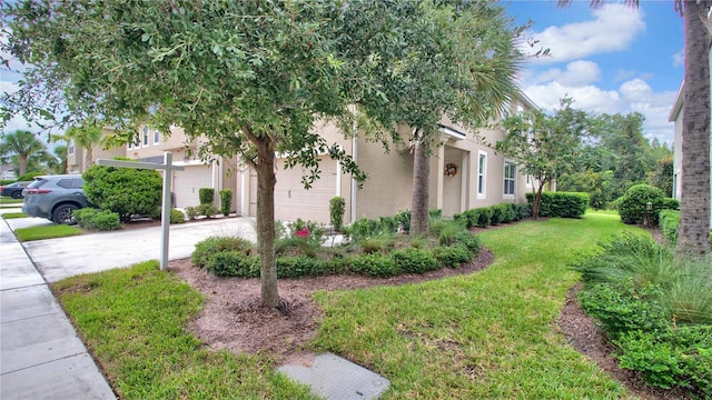 view of property exterior with concrete driveway, a lawn, an attached garage, and stucco siding