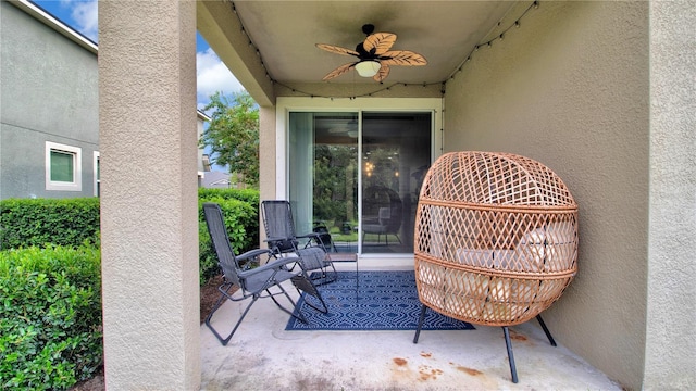 view of patio featuring ceiling fan