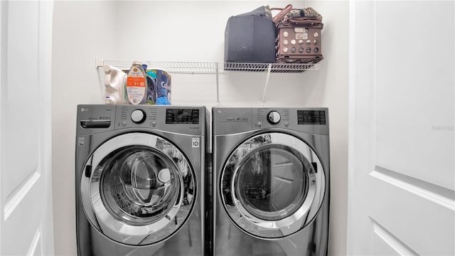 washroom with laundry area and washer and dryer