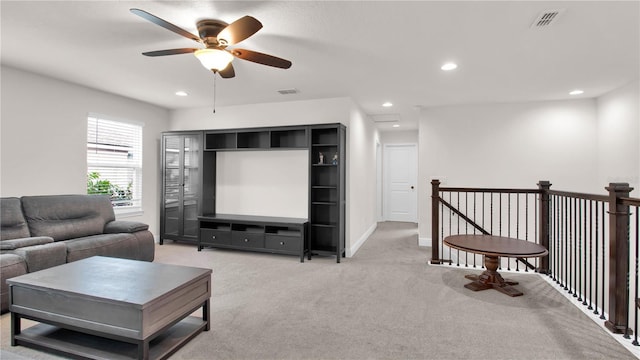 living room with light carpet, baseboards, visible vents, and recessed lighting