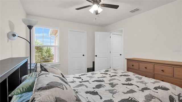 bedroom featuring visible vents and a ceiling fan