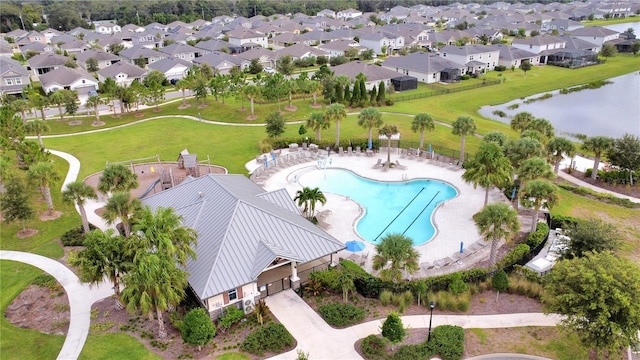 aerial view with a water view and a residential view