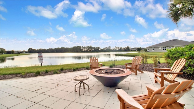 view of patio / terrace featuring a fire pit and a water view