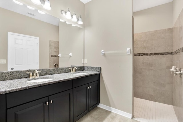 bathroom featuring dual vanity and tile patterned floors