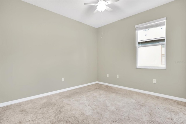 empty room with ceiling fan and carpet flooring