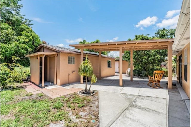 back of house featuring a patio