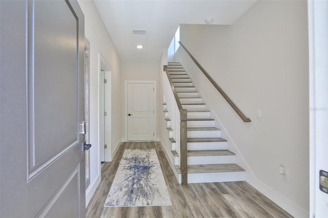 foyer with hardwood / wood-style flooring