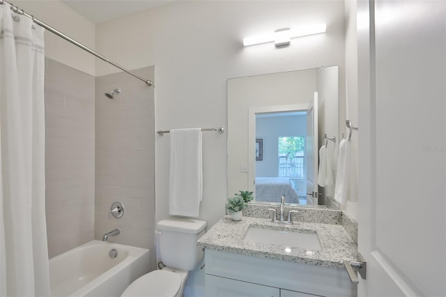 full bathroom with toilet, shower / tub combo with curtain, and vanity