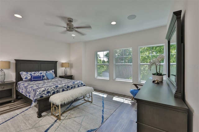 bedroom featuring ceiling fan and hardwood / wood-style floors