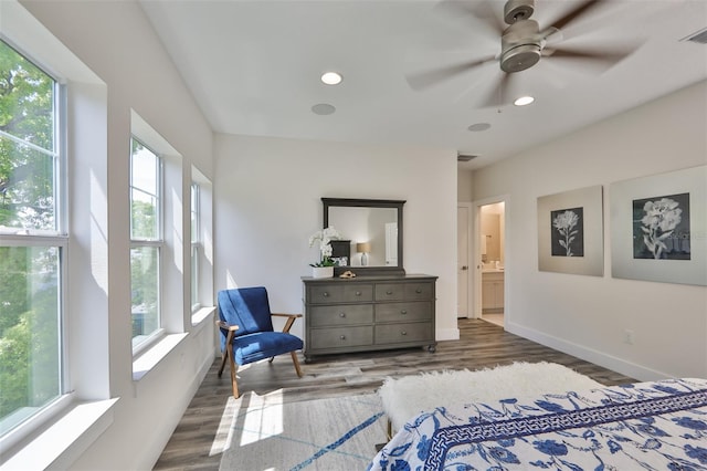 bedroom featuring ceiling fan, dark hardwood / wood-style floors, and ensuite bathroom