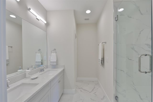 bathroom featuring tile patterned flooring, walk in shower, and dual vanity