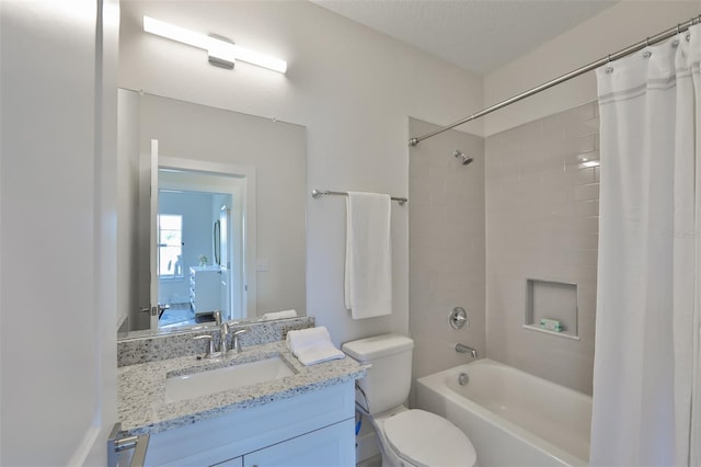 full bathroom featuring toilet, vanity, and shower / bath combo