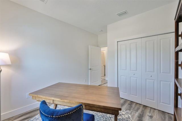 office with light wood-type flooring