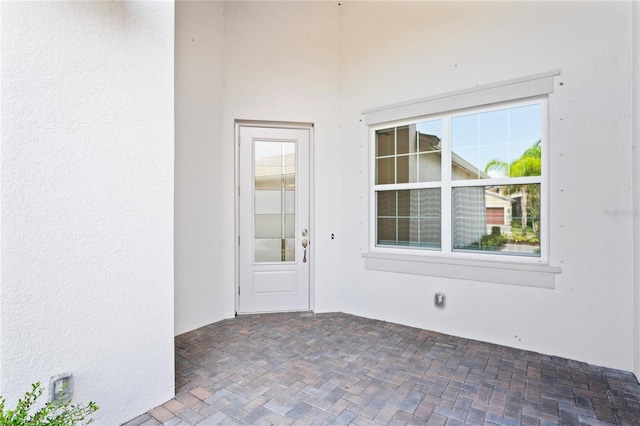 doorway to property featuring a patio area