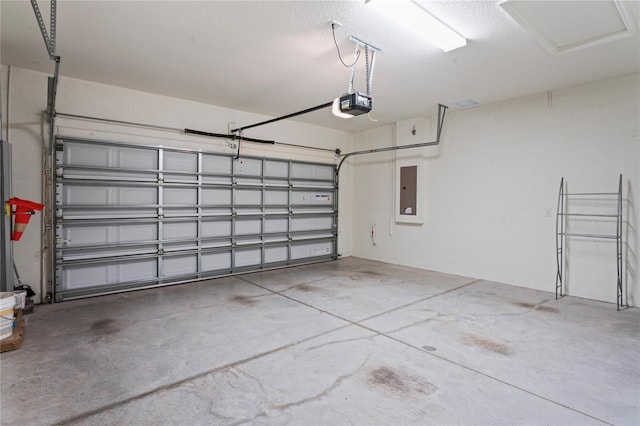 garage with electric panel and a garage door opener