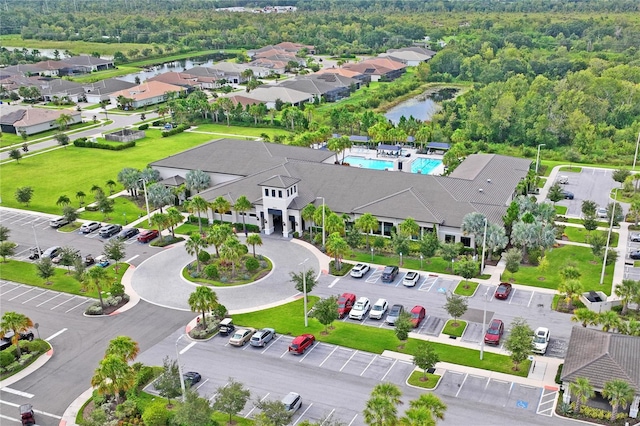 drone / aerial view featuring a water view and a residential view