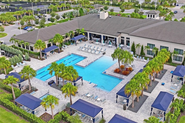 community pool with a patio area