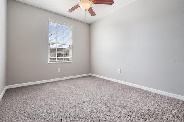 carpeted empty room with ceiling fan