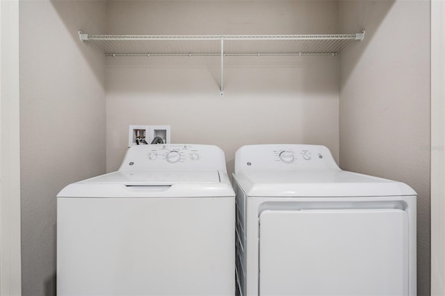 laundry room featuring washing machine and dryer