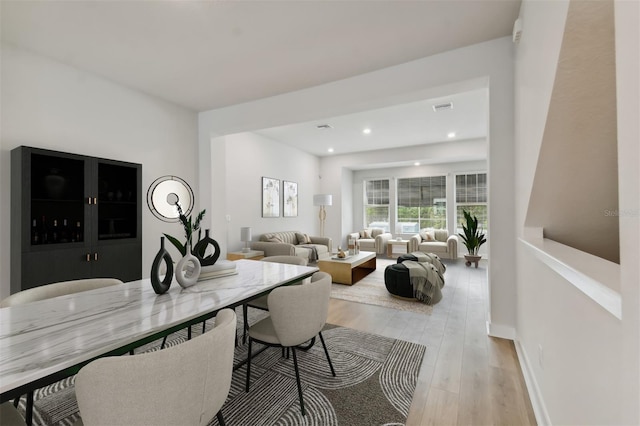 dining area with light hardwood / wood-style flooring