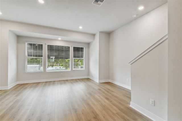 unfurnished living room featuring light hardwood / wood-style flooring