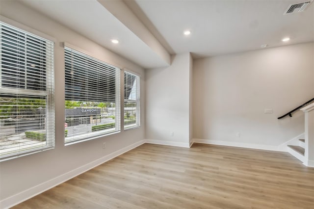 unfurnished living room with light wood-type flooring