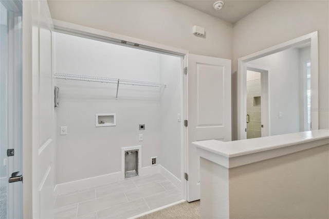 washroom with washer hookup, light tile patterned floors, and electric dryer hookup