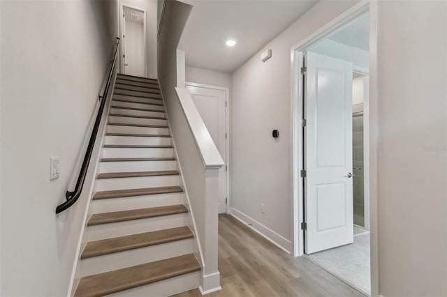 stairway with wood-type flooring