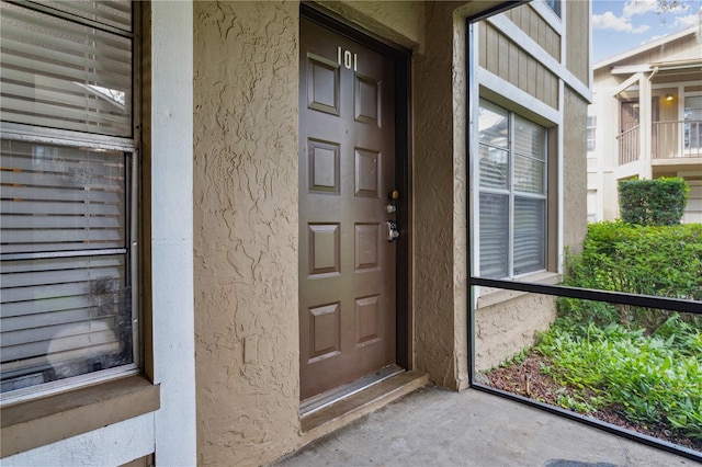 doorway to property featuring a balcony