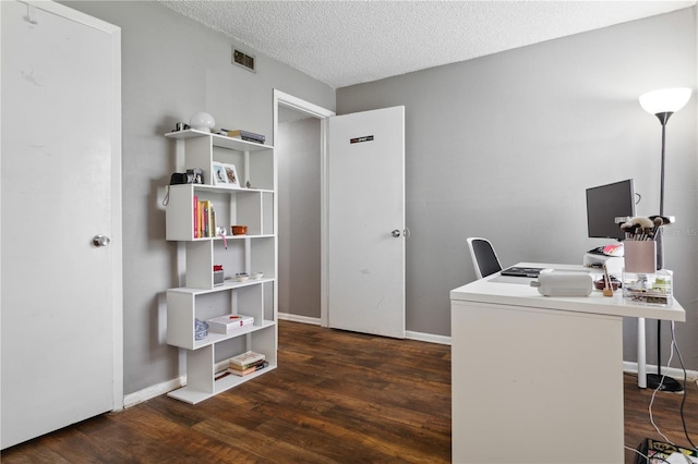 office area featuring dark hardwood / wood-style flooring and a textured ceiling