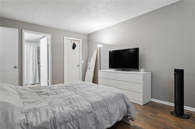 bedroom featuring a textured ceiling and hardwood / wood-style flooring