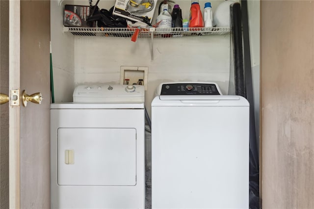 clothes washing area featuring washing machine and clothes dryer