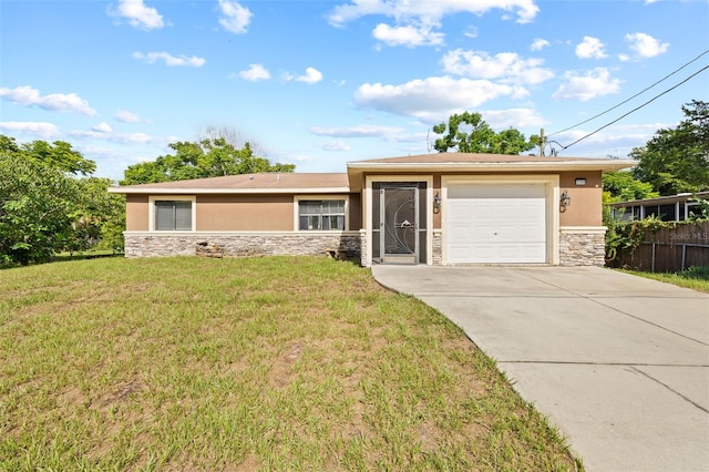 view of front of property featuring a garage and a front lawn