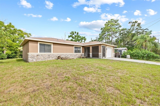 single story home featuring concrete driveway, stone siding, an attached garage, a front lawn, and stucco siding