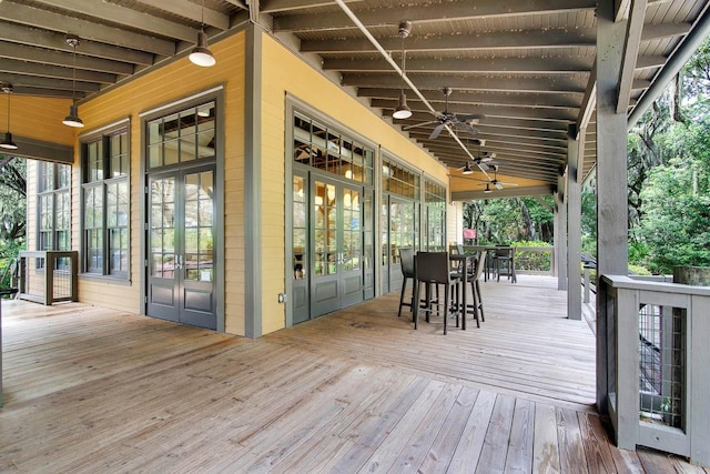 wooden deck featuring ceiling fan