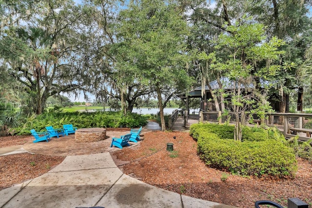 view of yard featuring an outdoor fire pit