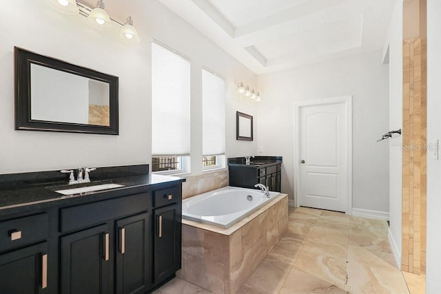 bathroom with vanity and tiled bath