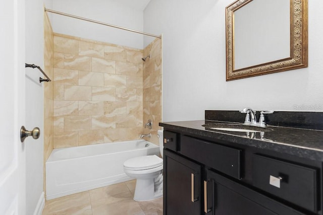 full bathroom featuring vanity, tiled shower / bath combo, toilet, and tile patterned floors