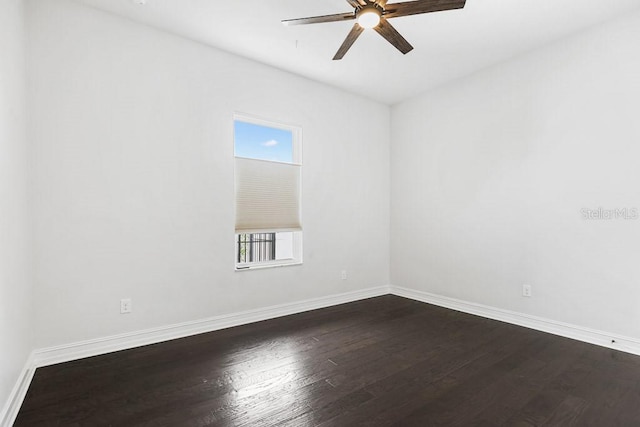 empty room with ceiling fan, hardwood / wood-style flooring, and plenty of natural light