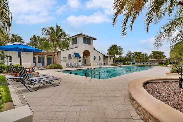 view of pool featuring a patio