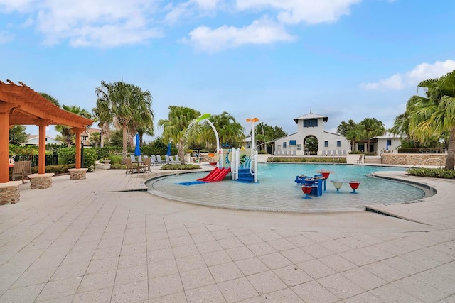 view of playground featuring a patio area, pool water feature, a community pool, and a pergola