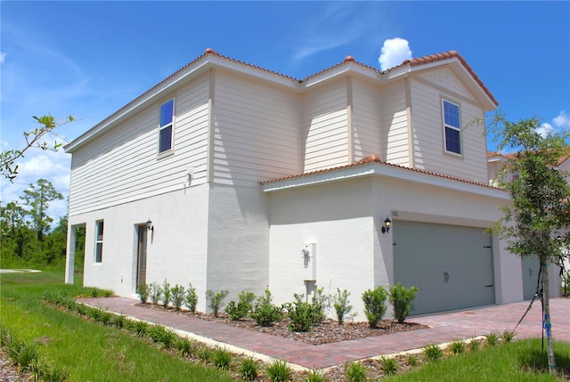 view of side of home with a garage