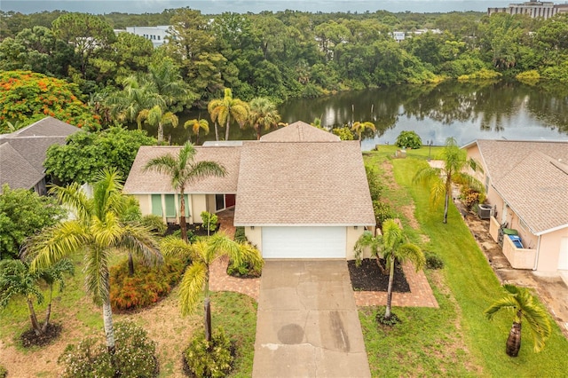 birds eye view of property with a water view